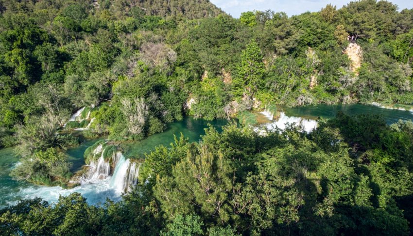 a waterfall in a forest